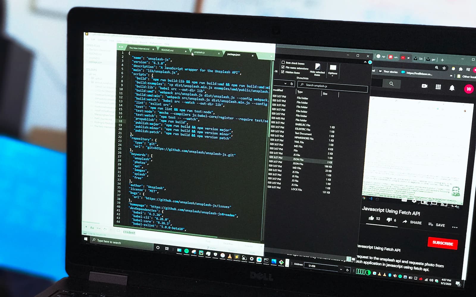 Code and project files open on a laptop during software development.