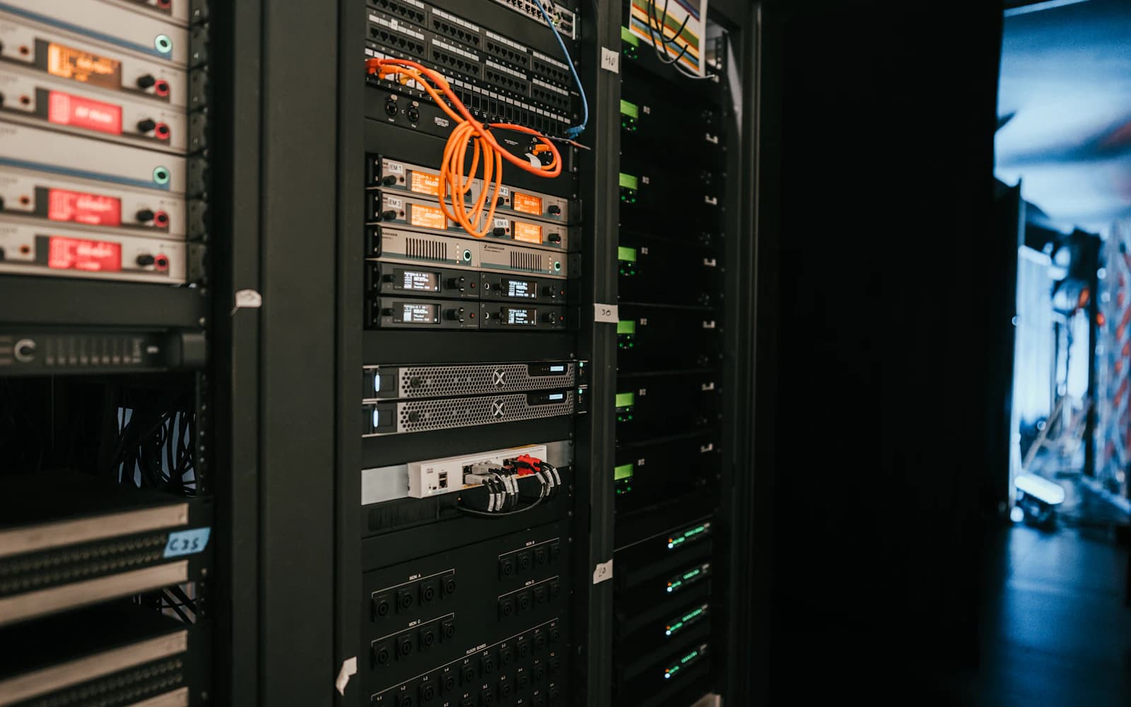 Server racks with connected cables in a data centre.